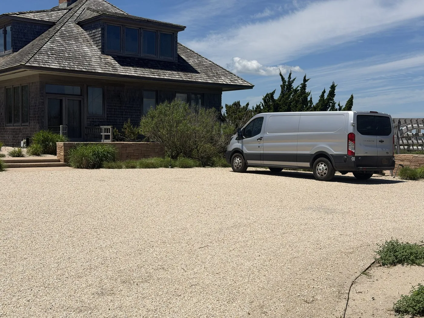 Smart Tek service van outside a Hamptons shingle home
